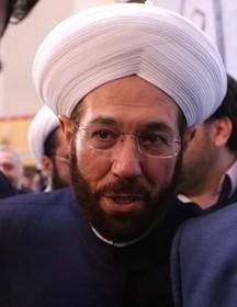 A person wearing a white turban

Description automatically generated with medium confidence