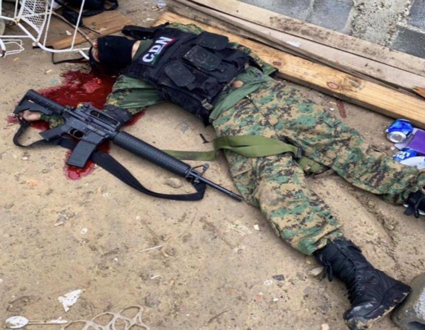 A picture containing ground, military uniform, gun

Description automatically generated