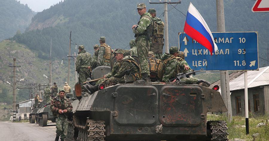 A column of Russian armored vehicles moves through North Ossetia towards the Georgia's breakaway republic of South Ossetia's capital Tskhinvali on August 8, 2008. (photo: AP/Musa Sadulayev)