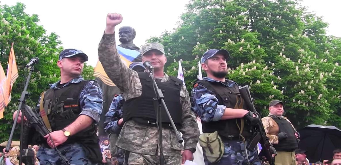 A group of men in military uniforms holding guns

Description automatically generated with low confidence