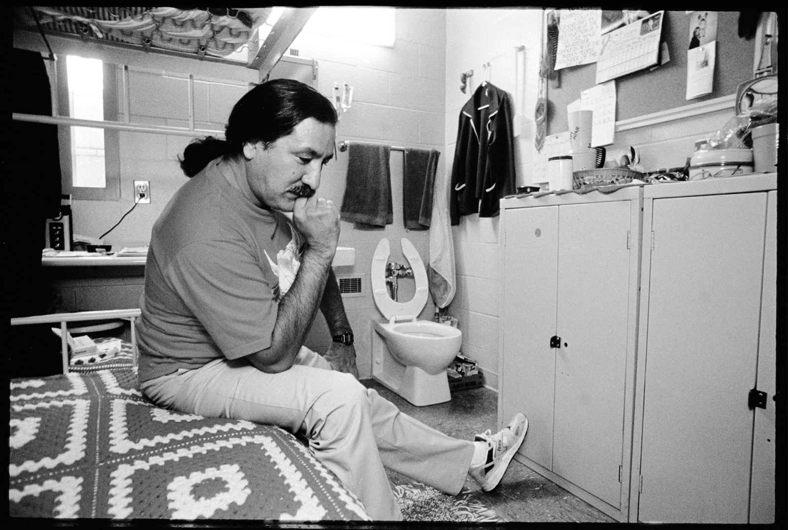 A person sitting on a toilet

Description automatically generated with medium confidence