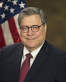A person wearing glasses and a suit

Description automatically generated with medium confidence
