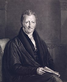 A picture containing person, black, suit

Description automatically generated