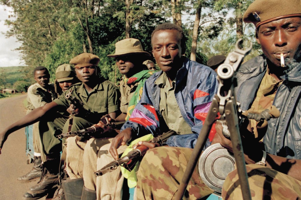 FILE - In this May 14, 1994, file photo, a pickup truck carries Rwandan Patriotic Front (RPF) rebels to front line positions closer to the capital Kig...
