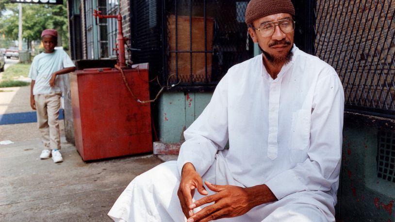 Imam Jamil Abdullah Al-Amin, the former H. Rap Brown, in front of his West End Community grocery store on Oak Street in 1990. (Kathryn Kolb/AJC file photo)