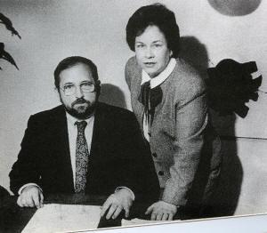 Two people sitting at a table

Description automatically generated with low confidence