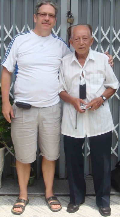 A couple of men posing for the camera

Description automatically generated with medium confidence