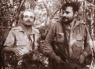 A couple of men posing for the camera

Description automatically generated with medium confidence