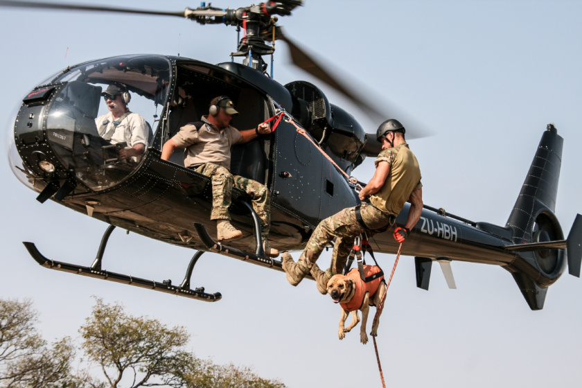 A group of men on a helicopter

Description automatically generated with low confidence
