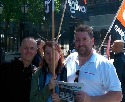A group of people holding signs

Description automatically generated with medium confidence