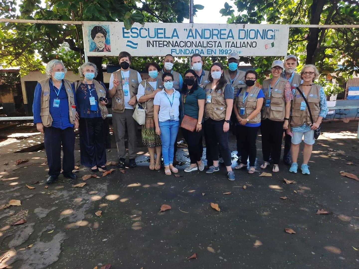 A group of people posing for a photo
Description automatically generated with medium confidence