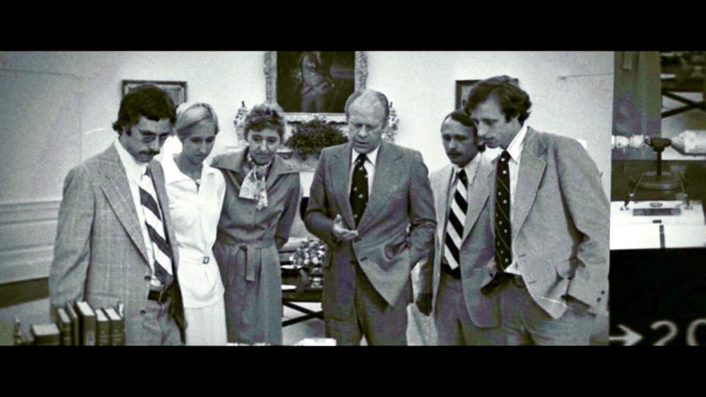A group of people posing for a photo
Description automatically generated