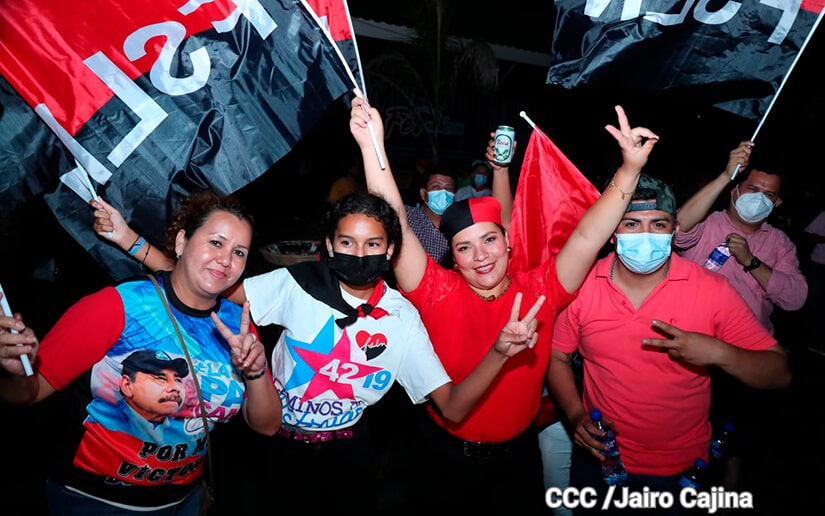 A group of people wearing masks and holding up their hands

Description automatically generated with low confidence