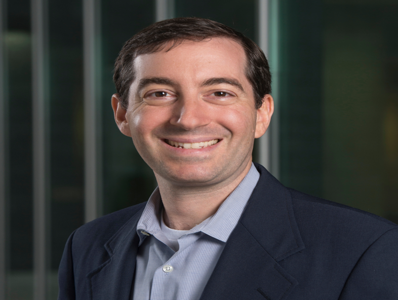 A person smiling for the camera
Description automatically generated with medium confidence