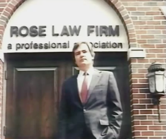 A person standing in front of a building
Description automatically generated with medium confidence