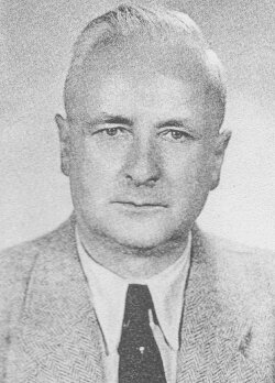 A person wearing a suit and tie
Description automatically generated with medium confidence