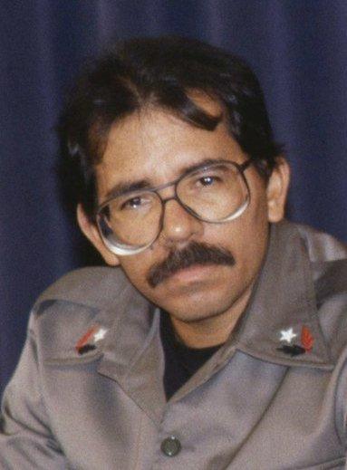 A person with a mustache and glasses

Description automatically generated with medium confidence