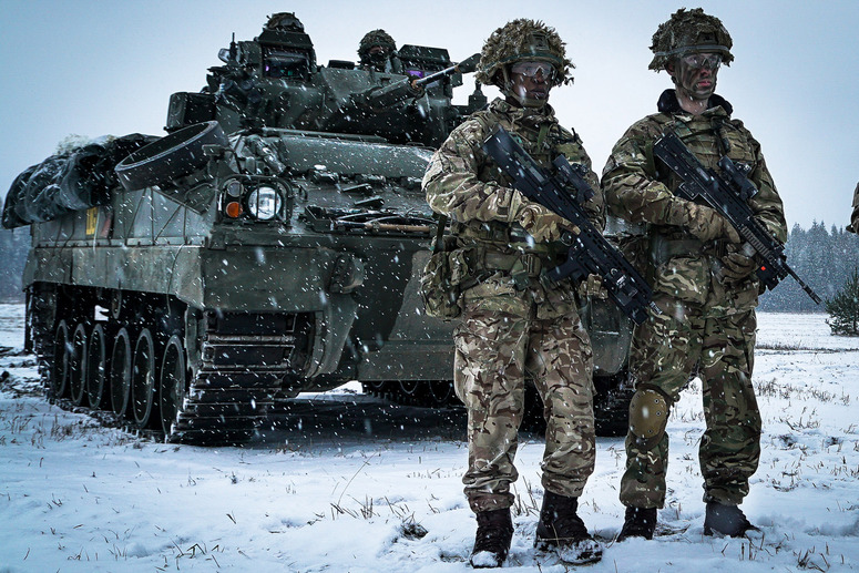 A picture containing outdoor, snow, person, military vehicle

Description automatically generated