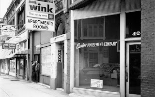 A picture containing text, building, outdoor, street
Description automatically generated