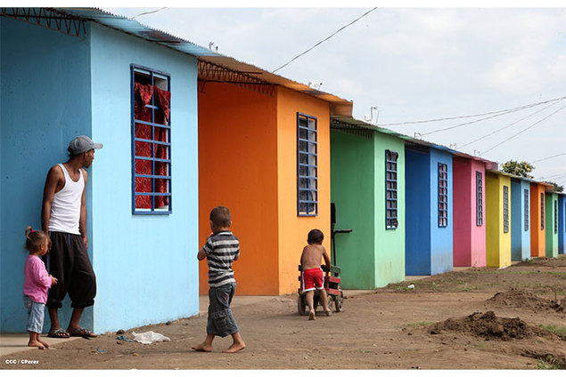 Families moving into new houses in Cuidad Belen
