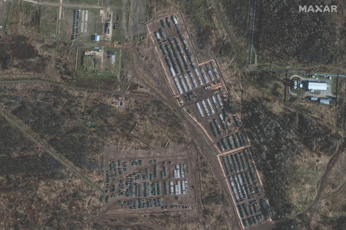 Satellite imagery shows armored units and support equipment.
