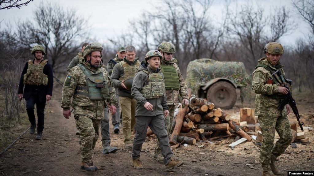 Ukraine's President Volodymyr Zelenskiy visits positions of armed forces near the frontline with Russian-backed separatists during his working trip in Donbass region, Ukraine April 8, 2021.