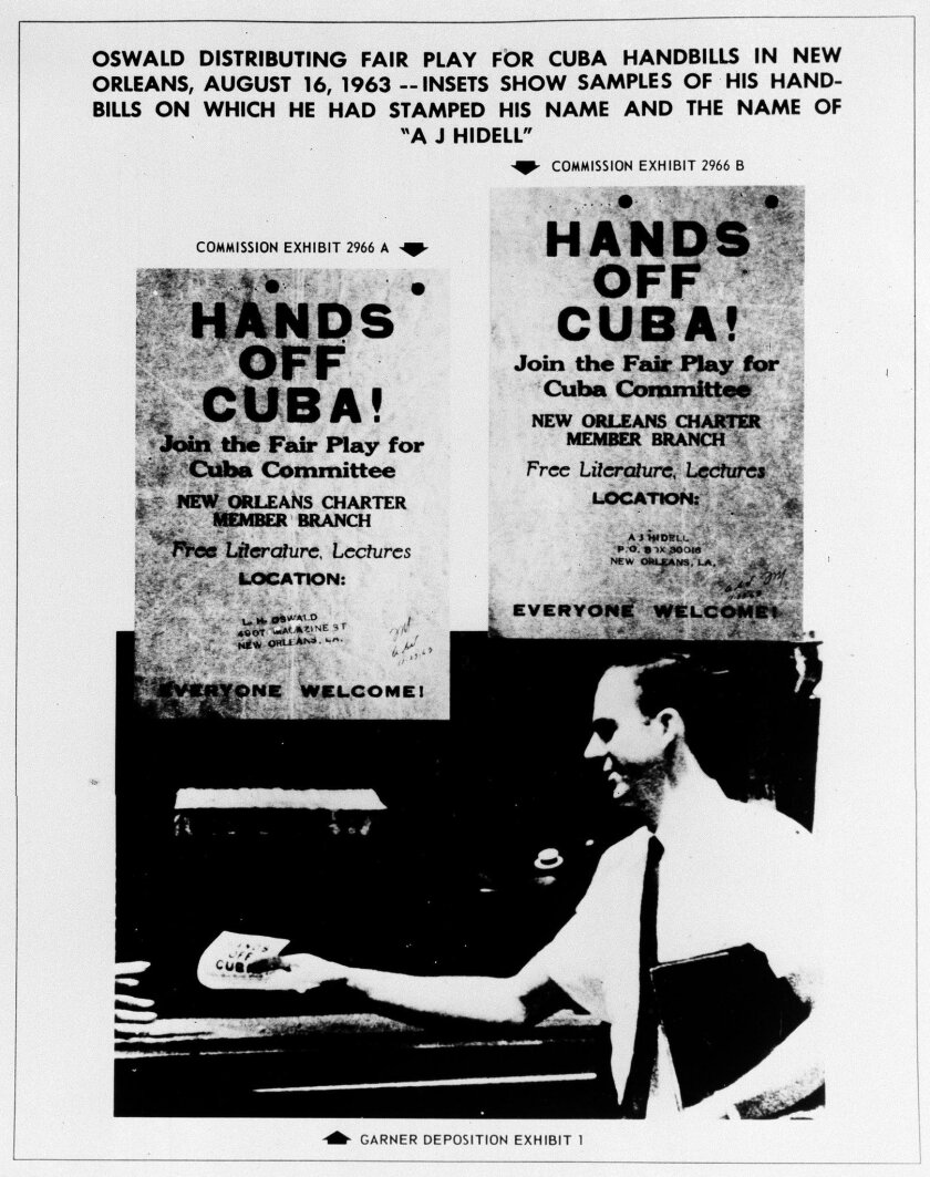 FILE - This Sept. 26, 1964 file photo shows one of the exhibits contained in the Warren Commission report on the assassination of President John F. Kennedy. The commission said the handbills in the image were samples of ones on which Lee Harvey Oswald had stamped his name and the name "A.J. Hidell". The image below was identified as showing Oswald distributing the handbills in New Orleans on Aug. 16, 1963. (AP Photo/Warren Commission)