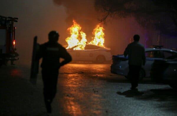 A burning police car during a protest in Almaty on Wednesday.