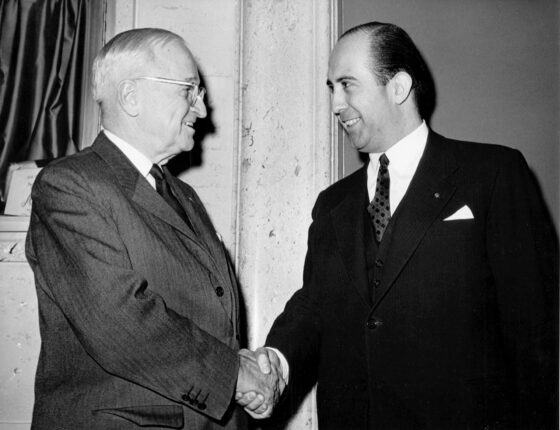 A pair of men shaking hands
Description automatically generated with medium confidence