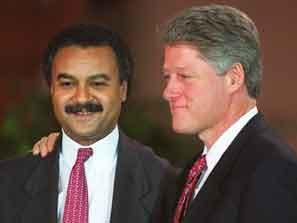 Bill Clinton, right, puts his arm around Ron Brown