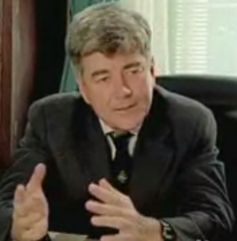A person in a suit

Description automatically generated with low confidence