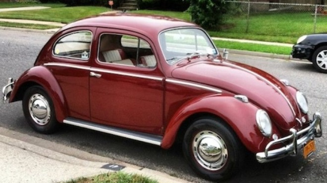 A red car parked on the side of a road
Description automatically generated with medium confidence