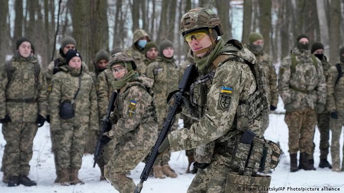 Members of Ukraine's Territorial Defense Forces, volunteer military units of the Armed Forces, train in a city park in Kyiv