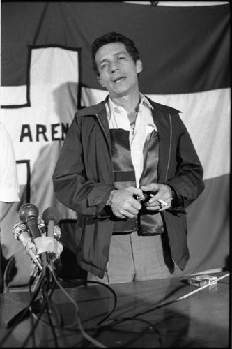 Roberto D'Aubuisson speaks with a cigarette in hand, San Salvador, 1982 —  Calisphere