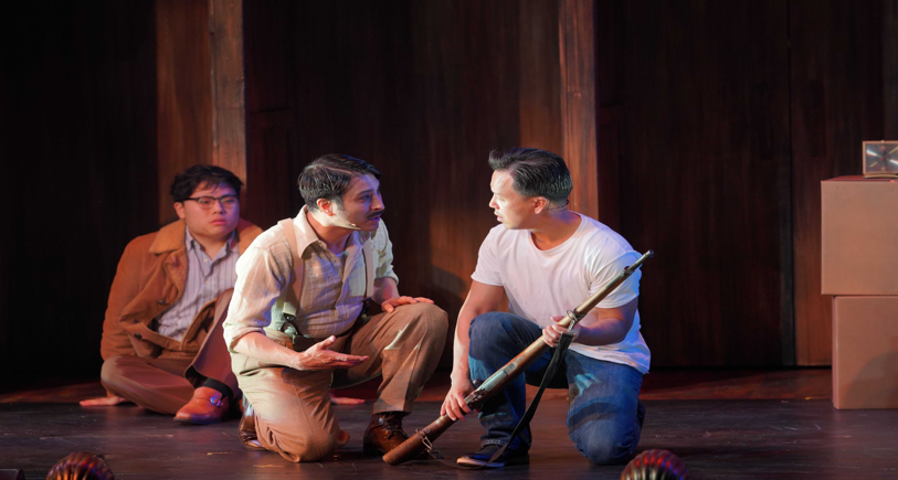 A group of men sitting on the floor
Description automatically generated with low confidence