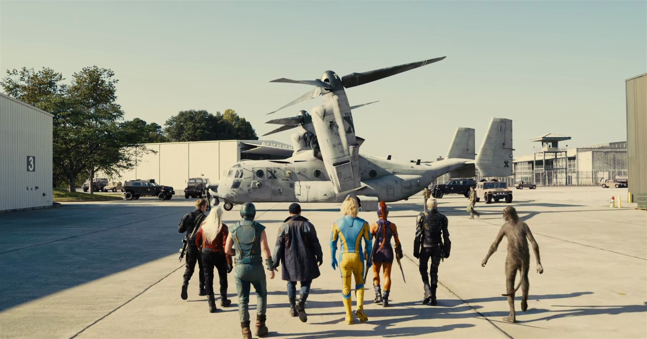 A group of people walking towards a helicopter

Description automatically generated with medium confidence