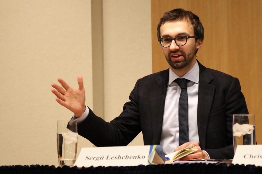 A person in a suit and tie

Description automatically generated with low confidence