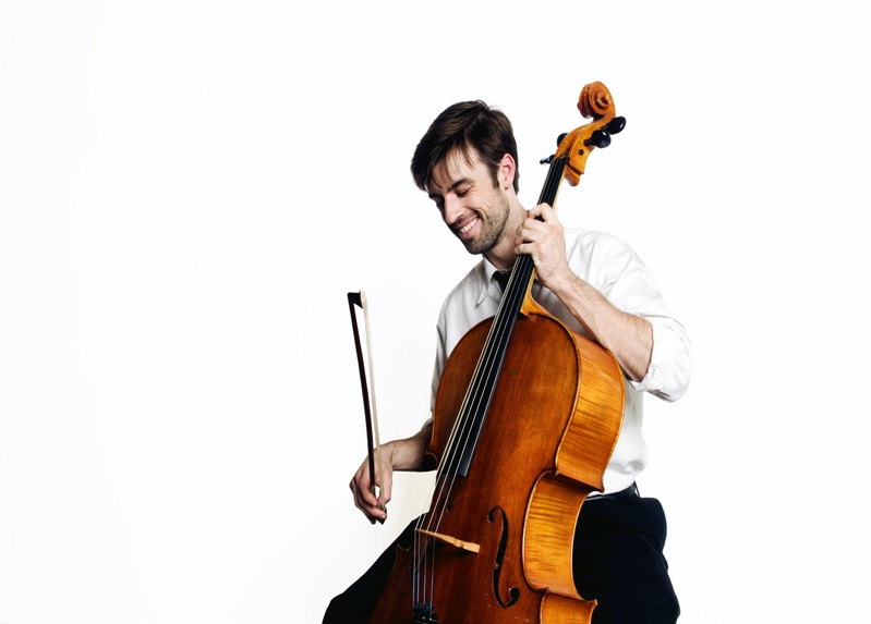 A person playing a cello

Description automatically generated