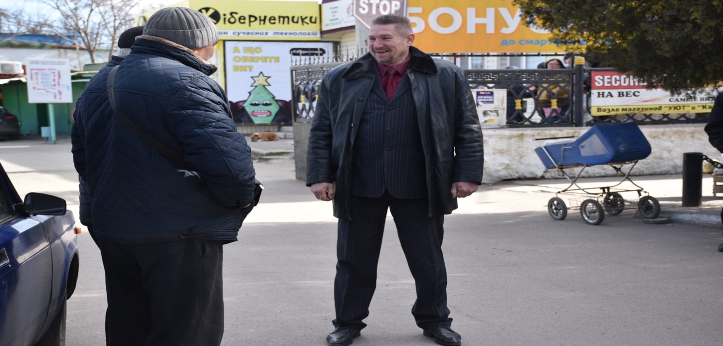 A picture containing person, outdoor, road
Description automatically generated