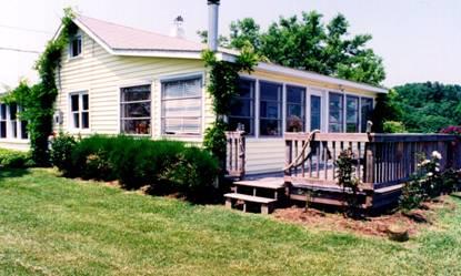 A picture containing grass, outdoor, sky, house
Description automatically generated