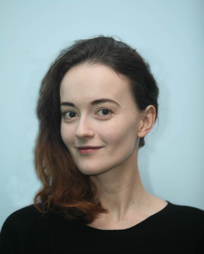 A picture containing person, wall, indoor Description automatically generated
