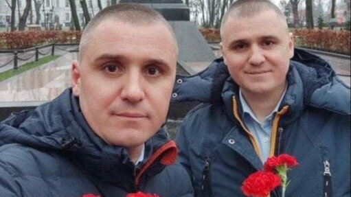 Two men taking a selfie

Description automatically generated