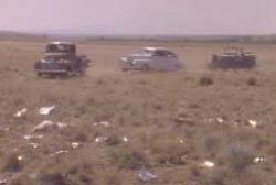 A group of military vehicles driving through a field

Description automatically generated with low confidence