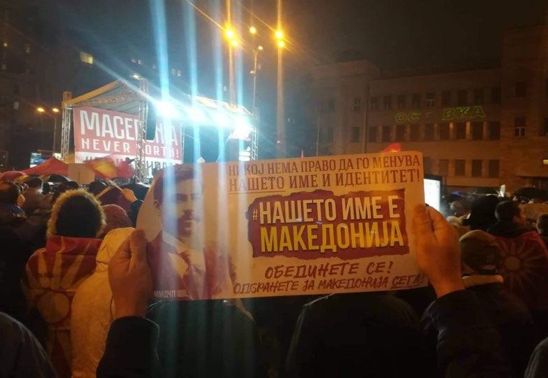 A group of people holding a sign

Description automatically generated with medium confidence