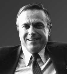 A person in a suit and tie

Description automatically generated with medium confidence