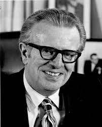 A person wearing glasses and a suit

Description automatically generated with medium confidence