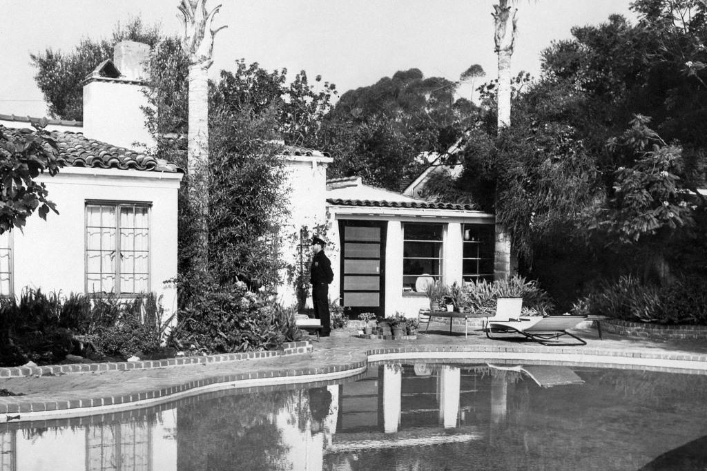 A policeman stands in front of Marilyn Monroe's house, where she was discovered dead, on June 5, 1962, in Brentwood. 