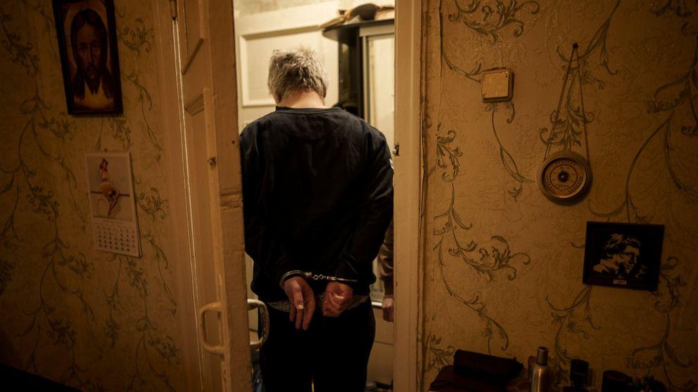 FILE - A man suspected to be a Russian collaborator is detained during an operation by Security Service of Ukraine (SBU) in Kharkiv, Ukraine, Monday, April 18, 2022. Ukrainian authorities are cracking down on anyone suspected of aiding Russian troops