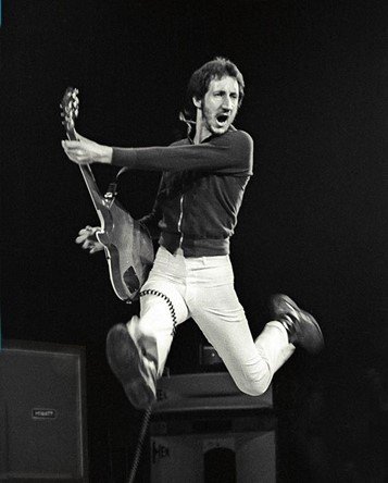 A person jumping with a guitar

Description automatically generated with medium confidence