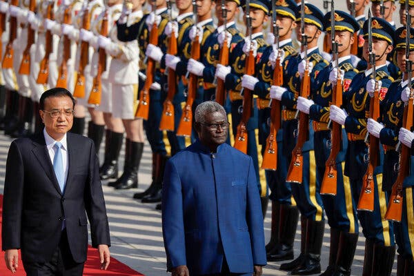 Li Keqiang, left, the Chinese premier, and Prime Minister Manasseh Sogavare of the Solomon Islands reviewing an honor guard during a ceremony  in Beijing in 2019.